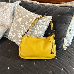 Coach - Mustard pebbled leather; includes longer strap to be worn as crossbody